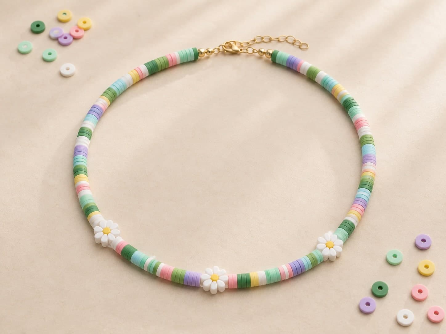 Green and pastel clay-bead necklace with daisy beads